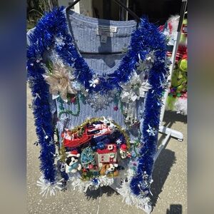 Festive Blue Sweater with Holiday Decorations